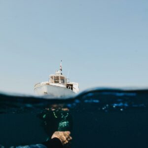 A Yacht On Sea And Man Underwater